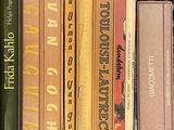 many books that are on a shelf in the room