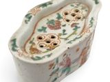 a small white bowl with a floral design on it