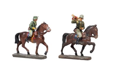 two figurines of men riding horses on a white background