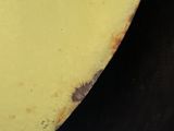 a close up view of a banana with a lot of brown spots on it