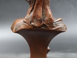 an image of a statue of a man sitting on top of a bust