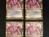 quatre cartes de jeu sur lesquelles figure l'image d'un dragon