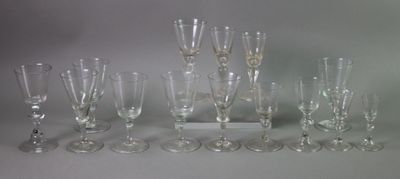 a lot of wine glasses that are sitting on a table
