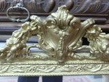 a picture of a gold frame with a mirror in it