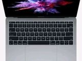 a close up of a laptop computer on a white surface