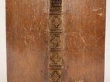 an old book sitting on top of a wooden table
