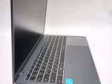 a laptop that is sitting on a white surface