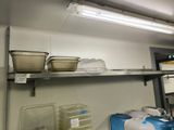 a shelf that has some containers and containers on it