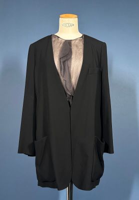 an image of a suit on a mannequin stand