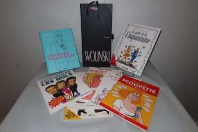a lot of books on a table with a bag
