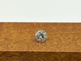 a close up of a diamond on top of a wooden box