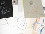 many drawings of a woman sitting on a table