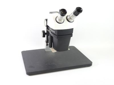 an image of a close up of a microscope on a white background