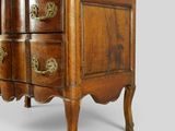 an old wooden chest of drawers with brass handles and drawers on each side