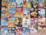 a lot of comic books on the table together