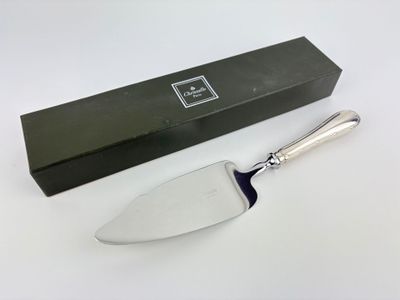 a knife that is sitting on a table next to a box