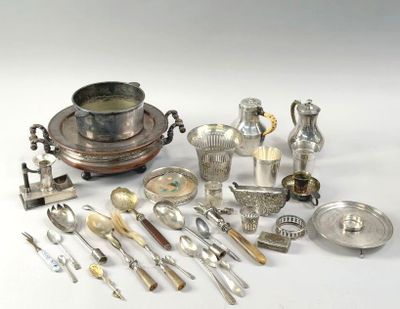 a lot of silver and silverware on a white table