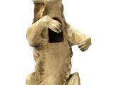 a small statue of a bear sitting on its hind legs