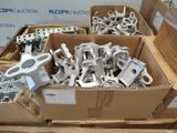 a box full of metal parts that are sitting on a table