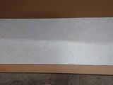 a cardboard box that has a piece of paper on it