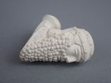 an image of a white sculpture of a woman ' s head on a gray surface
