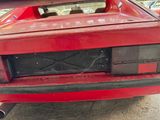 an image of a red sports car parked in a garage