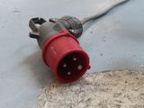 a close up of a red and black electrical plug