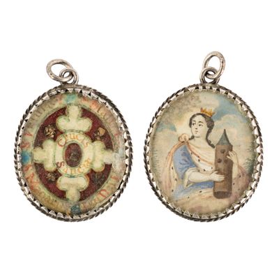 two pendants with a painting of a woman holding a child