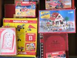 a box full of toys that are sitting on the floor