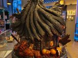 a statue of a tree with leaves on top of it