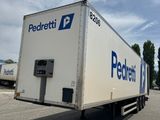 a delivery truck that is parked on the side of the road