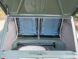 two seats in the back of a truck with the trunk open