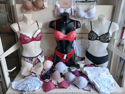 many bras and lingersuits on display in a store