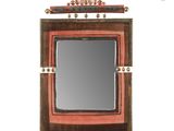a picture of a mirror that is hanging on the wall