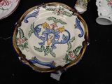 a plate with a design on it sitting on a table