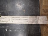 a marble column on the floor in a room