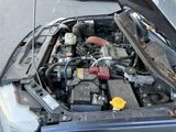 a car engine with its hood open on the street
