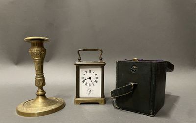 three different types of clocks and a book on the table
