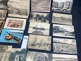 several old black and white photographs of people and buildings