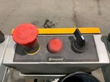 a picture of a machine that has two red buttons on it