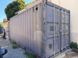 a large gray container sitting on the side of a building