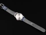 an image of a close up of a wrist watch on a black background