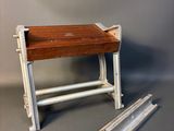 a small table with a wooden top and metal legs