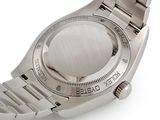 a watch that is sitting on a white surface