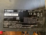 a close up of a yamaha power amplifier on a table