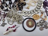 many different types of jewelry on the table