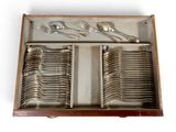 silverware in a wooden box with spoons and spoons in it