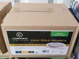 several boxes of coffee are stacked on top of each other