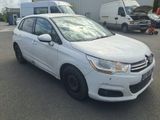 a picture of a white car parked in a parking lot