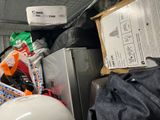 a pile of assorted items in a storage area